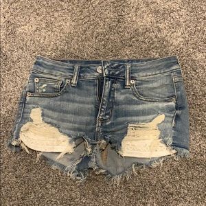 American Eagle jean shorts with crocheted pockets